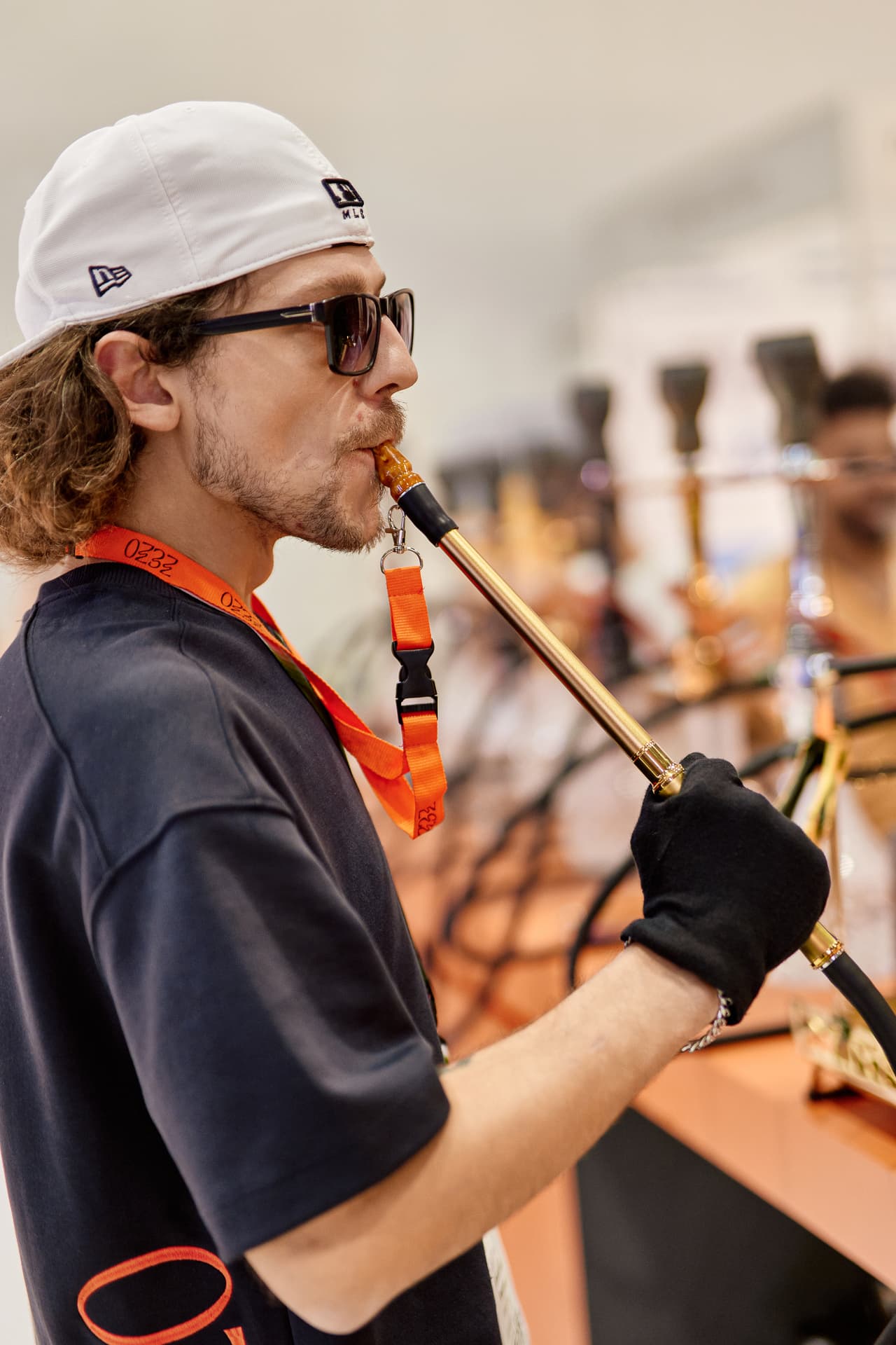 Lifestyle portrait focused on the hookah smoking ritual